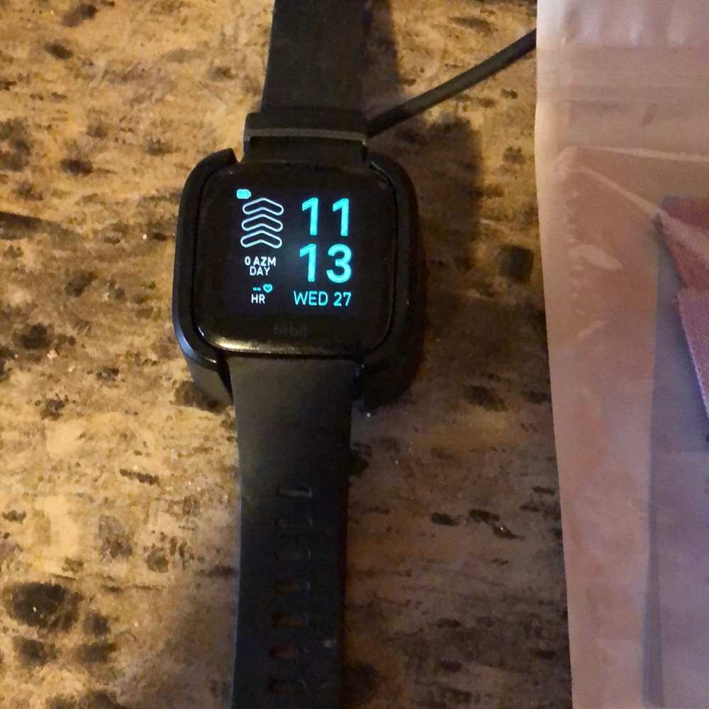 Fit bit versa with 3 brand new bands total of 4 comes with charger